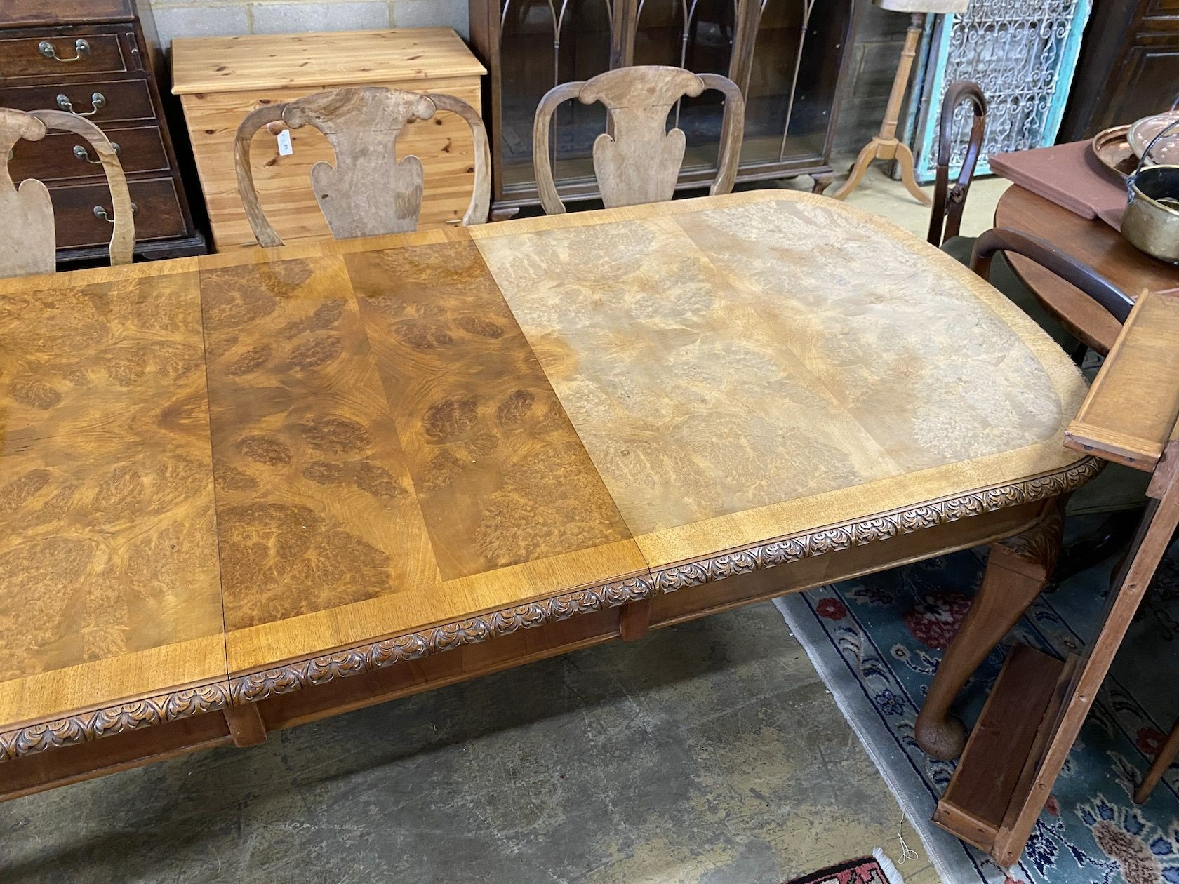 A Queen Anne revival burr walnut extending dining table, approx. 250cm extended, two spare leaves, width 90cm, height 77cm